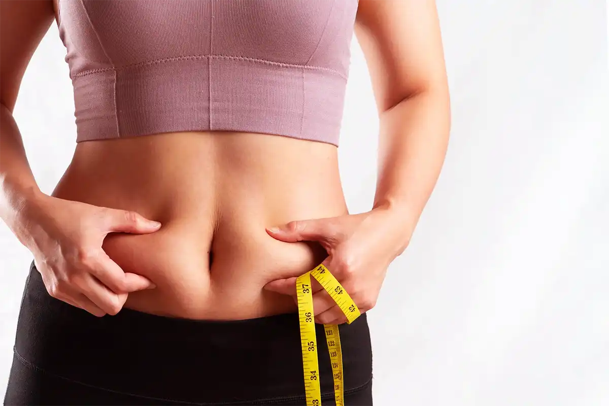 Woman-Pinching-Belly-Fat